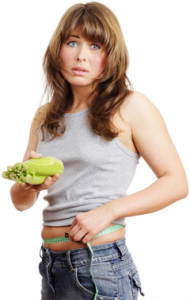 unhappy-woman-holding-a-vegetable