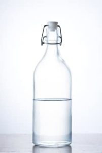 glass bottle of water half full